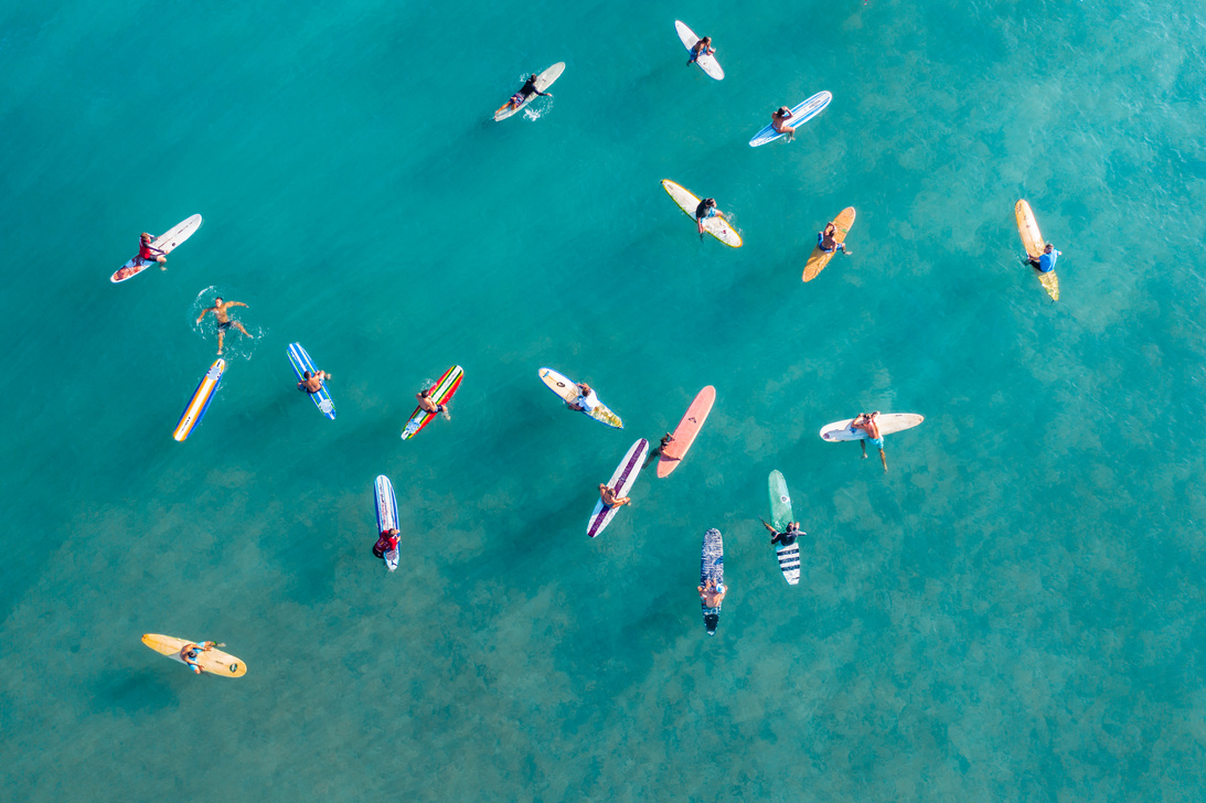 People riding Surfboards in the Ocean